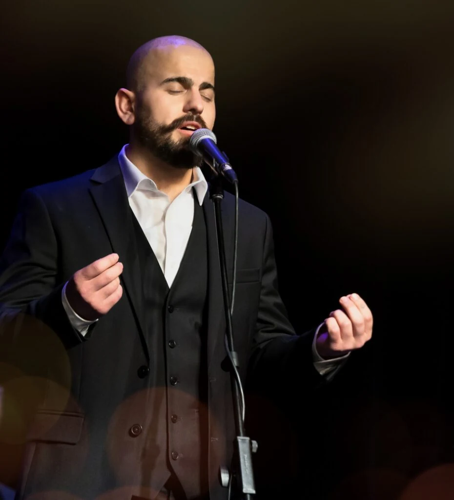 Original performance photograph of Ramah at a microphone