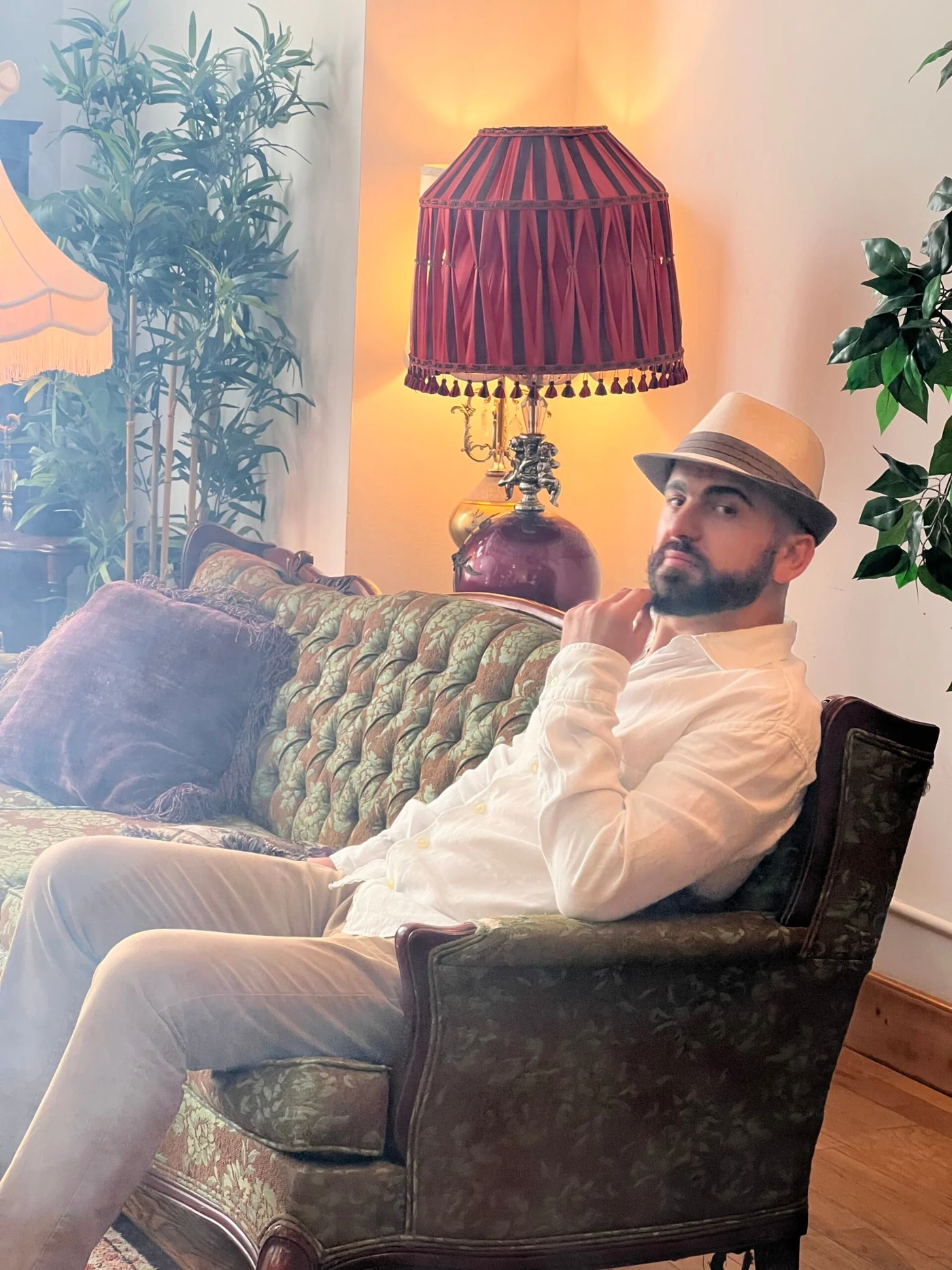 Ramah seated in a warmly lit lounge